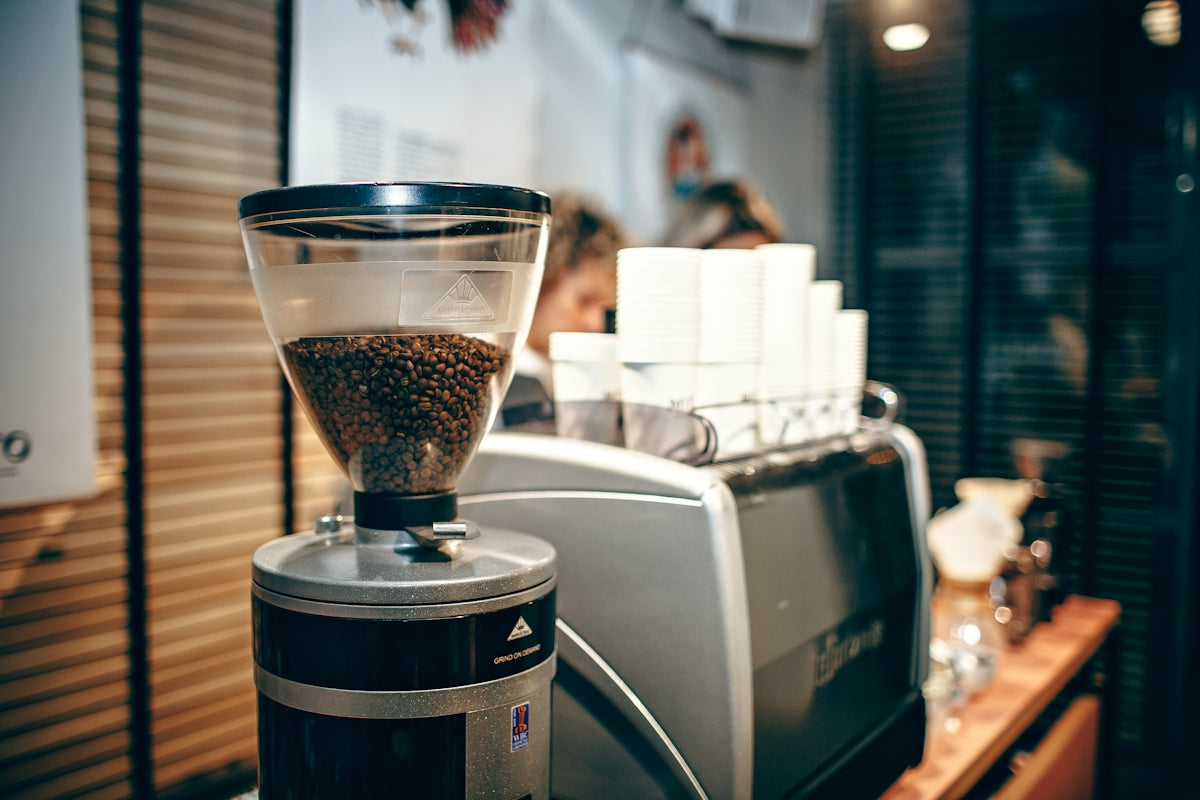 silver and black coffeemaker on table