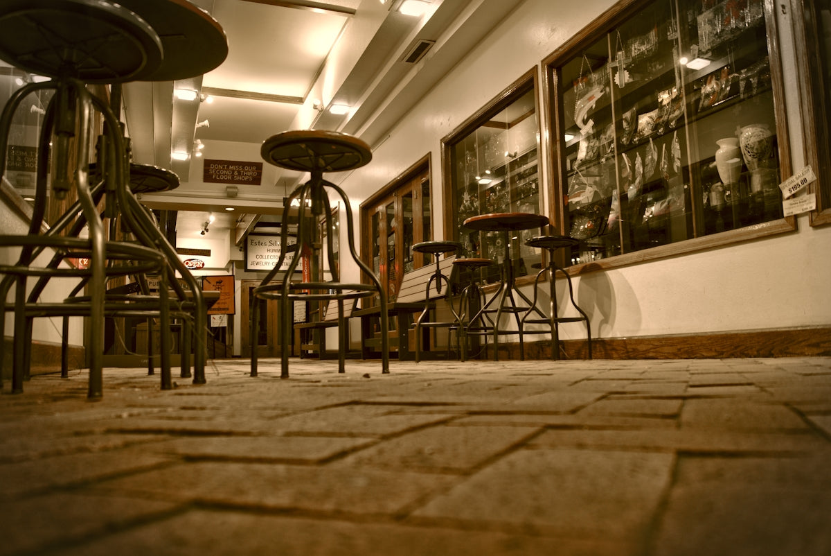 a group of chairs and tables in a room