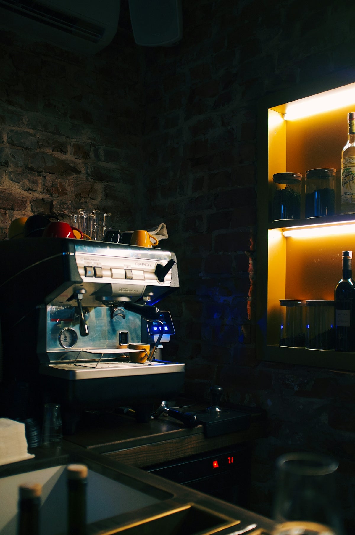 stainless steel and black coffee maker