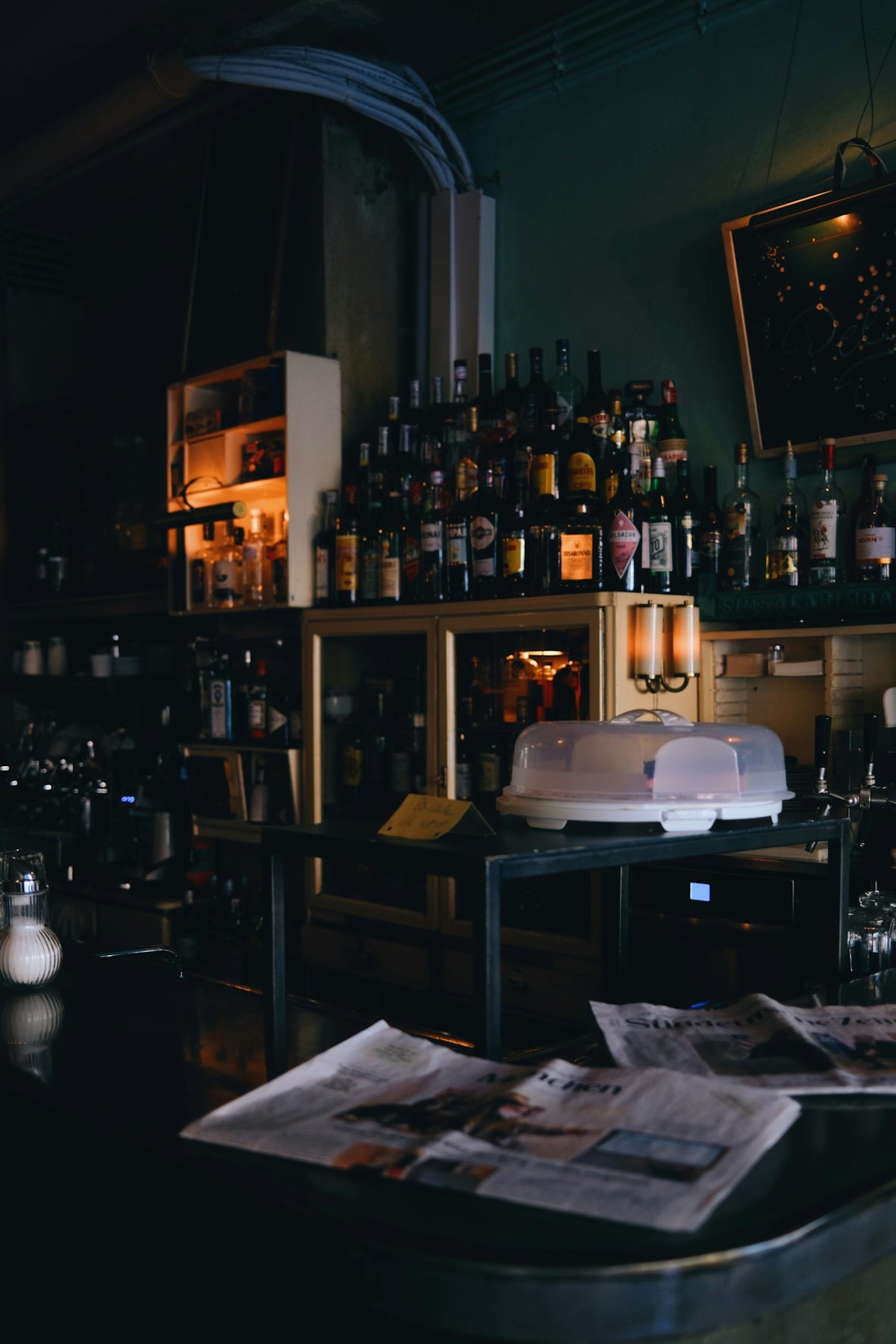 a bar filled with lots of bottles of alcohol